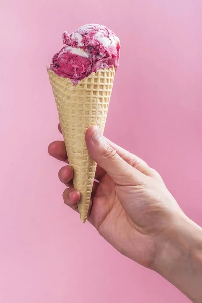 Mans hand holding ice cream