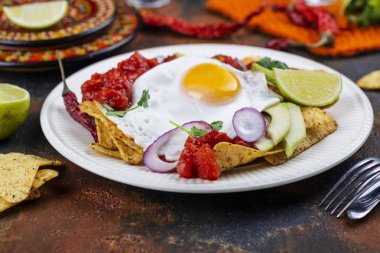 Mexican breakfast - chilaquiles dish clipart