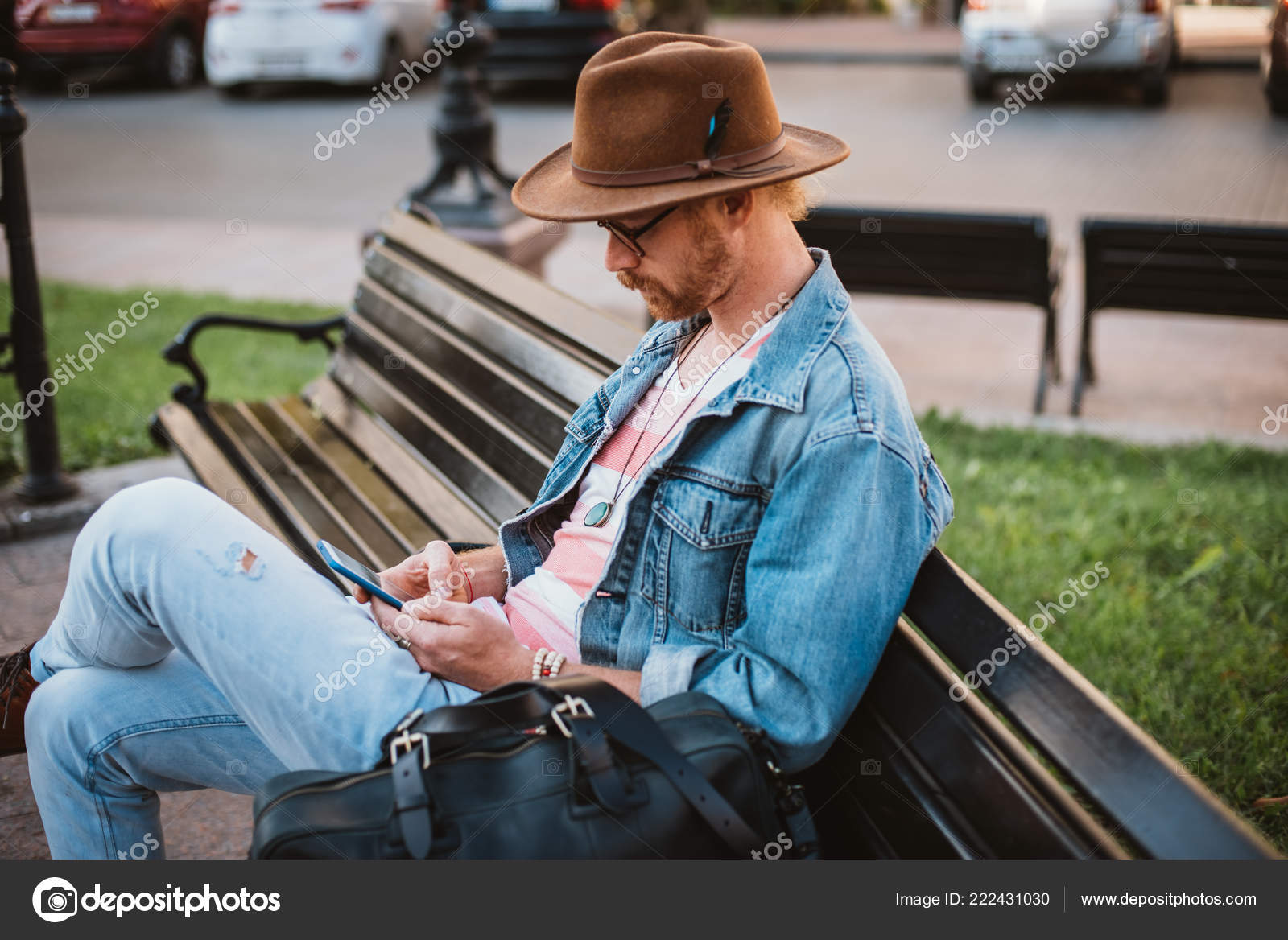 Young Bearded Hipster Man Bag Hat Sits Bench City Center Stock