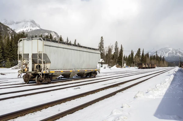 Freight Railroad Car in Train Station in the Mountains in Winter. Banff, AB, Canada.