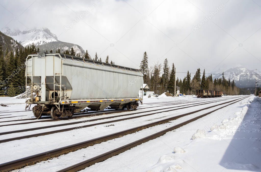 Freight Railroad Car in Train Station in the Mountains in Winter. Banff, AB, Canada.