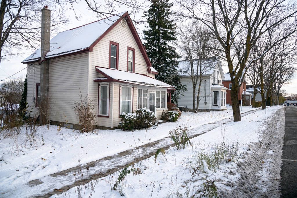 Traditional American Detached Houses Covered in Snow on a Cold Winter Day. Ontario, Canada.