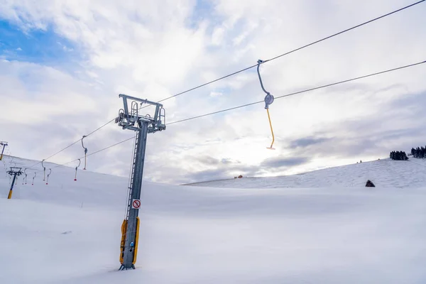 Empty Ski Lift Snowy Slope Alps Cloudy Winter Day — Stock Photo, Image