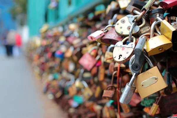 Many wedding locks on the bridge in Prague. Beautiful wedding background. Background for wedding photo books.