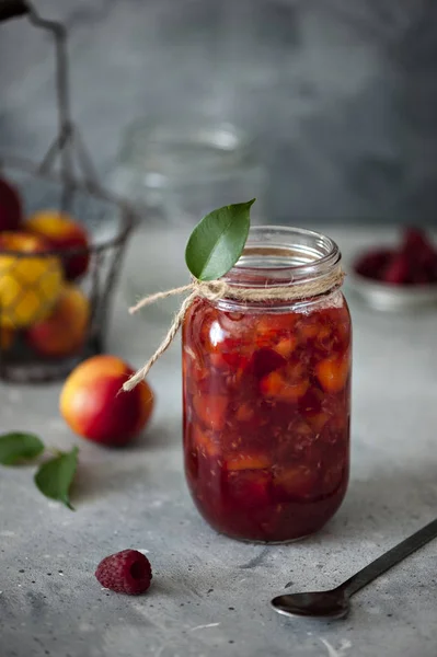 Fresh Homemade Nectarine Jam Raspberries Glass Jar Grey Stone Table — Stock Photo, Image