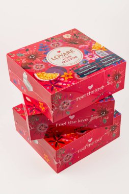 Ukraine Lviv 20.08.25Three boxes with floral designs are stacked, showcasing bright colors and the message Feel the love, offering a cheerful and inviting presentation.