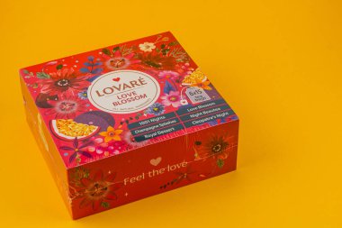 Ukraine Lviv 20.08.25A decorative gift box adorned with flowers and a vibrant background. It showcases an assortment of delights, perfect for any occasion or celebration.