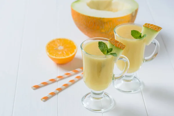 Two Glass Mugs Melon Smoothie Fruit White Wooden Table Diet — Stock Photo, Image