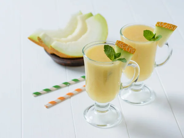 Two Glasses Melon Smoothie Two Cocktail Tubes White Wooden Table — Stock Photo, Image