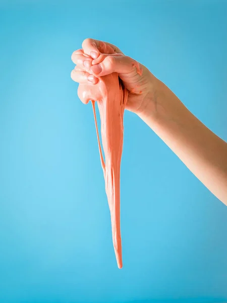 Drop an orange slime stems from the child's hands.