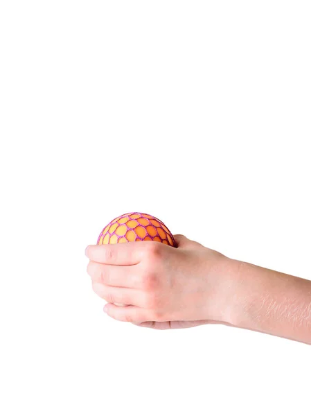 Brinquedo contra o estresse nas mãos de uma criança isolada em um fundo branco . — Fotografia de Stock