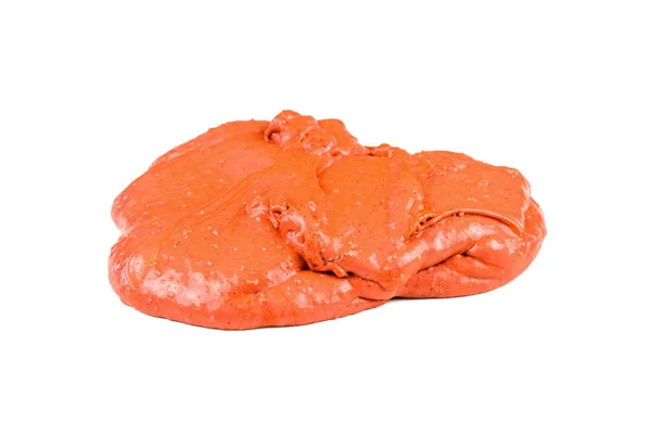 Een verspreiding stuk van helder oranje slijm geïsoleerd op een witte achtergrond. — Stockfoto