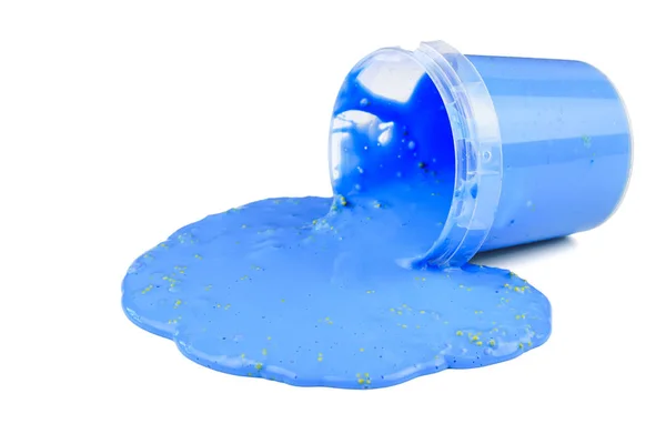 The blue slime flows out of the plastic bucket isolated on a white background. — Stock Photo, Image