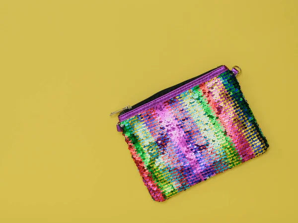 Multi-colored women's bag on a yellow background. Fashion women's accessory. Flat lay. — Stock Photo, Image