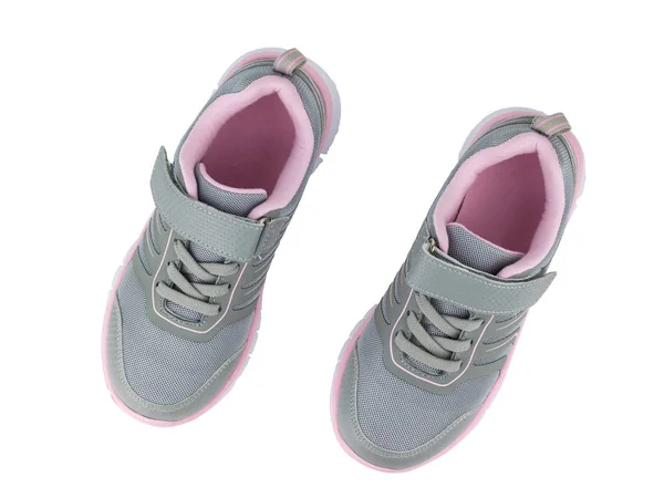 Trendiga grå sneakers med röd kant isolerad på vit botten. Utsikten från toppen. — Stockfoto
