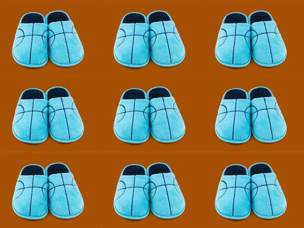 Nahtloses Muster blauer Hausschuhe auf braunem Hintergrund. — Stockfoto