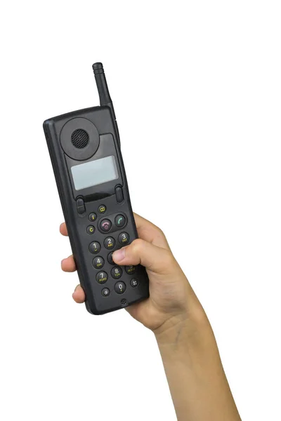 Dziecko ' dłoń tarcze kombinacja u retro telefon odizolowany u biały tło. Retro środki komunikacji. — Zdjęcie stockowe