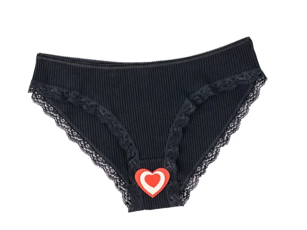 Black cotton women\'s briefs with heart in the middle isolated on white background.
