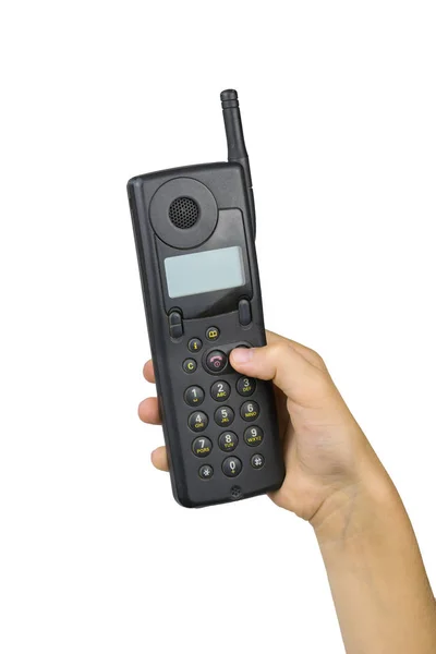 Teléfono móvil vintage en la mano derecha del bebé aislado sobre fondo blanco. Medios de comunicación retro . —  Fotos de Stock