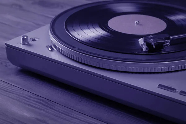 The image of the vinyl player is tinted in blue. — Stock Photo, Image