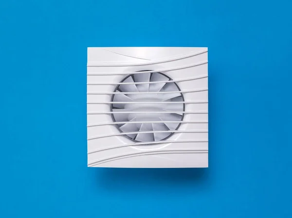 White exhaust fan on a bright blue background.