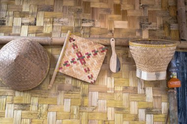 Background of rice harvest and traditional kitchen utensils.