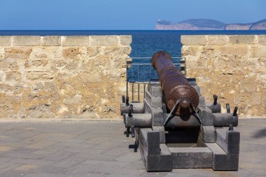 Historical cannon in old town of Alghero, Sardinia island, Italy
