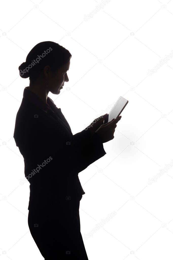 Young woman in suit shows pointer forward, side view - silhouette