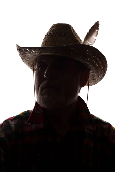 カウボーイハットの老人、正面図 - 暗いクローズアップシルエット — ストック写真