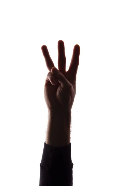 Рука молодого чоловіка з роздвоєними пальцями, номер три силует — стокове фото