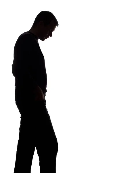 Retrato de un joven, vista lateral - silueta aislada oscura —  Fotos de Stock