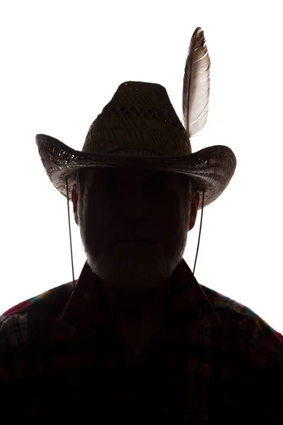 Homem velho em chapéu de cowboy, visão dianteira - silhueta de close-up escura — Fotografia de Stock