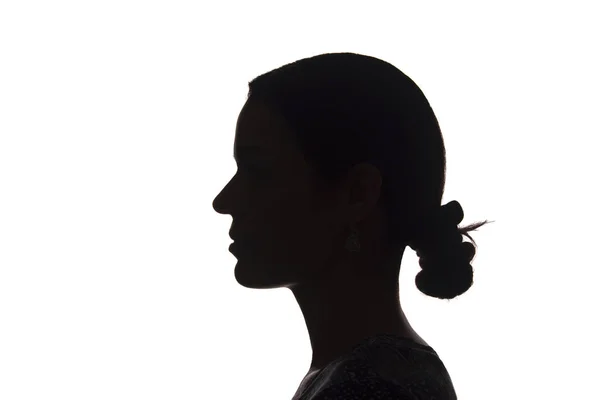 Sylwetka młoda dziewczyna widok z boku z fryzurą-na białym tle — Zdjęcie stockowe