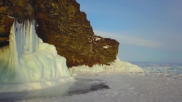 Winter ice rock Olkhon Island on Lake Baikal in a small sea, aerial photography — Stock Video
