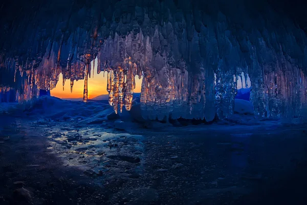 Sunset in a cave grotto with icicles in the winter on Olkhon Island, Lake Baikal — Stock Photo, Image