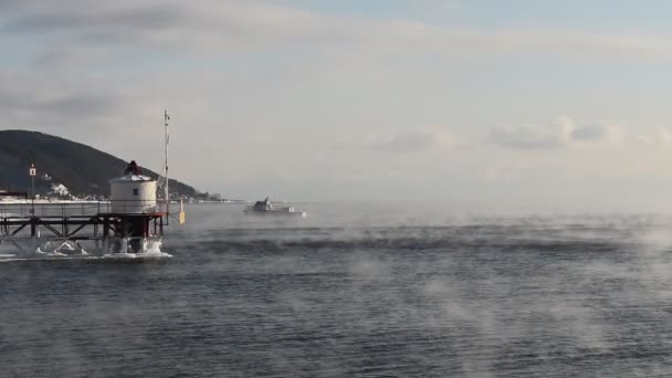 Ship sails on the lake Baikal floating from frost in January — Stock Video