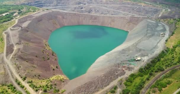 Aerial view of flooded quarry Mining-dressing quarry is flooded. — Stock Video