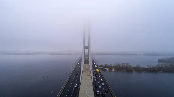 Bridge in the fog. Aerial view of South subway cable bridge. Kiev, Ukraine. — Stock Photo, Image