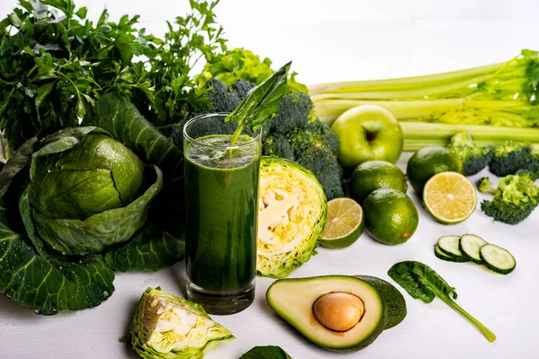 Green smoothie avocado and cauliflower drinks on white wooden background. Raw food and drink. — Stock Photo, Image