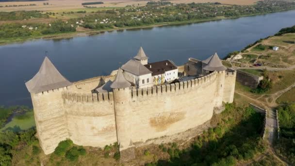 Aerial view of old castle near the River. Hotyn Castle in Ukraine. Eastern Europe. Zoom in. — Stock Video