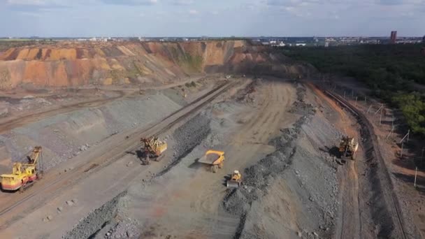 Large mining dump truck near the open quarry aerial view. — Stock Video