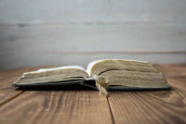 open old bible on wooden background