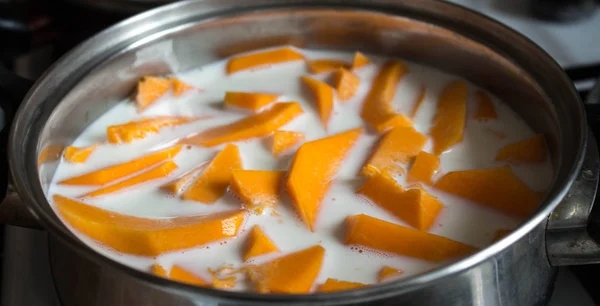 pumpkin sliced with milk in the pan