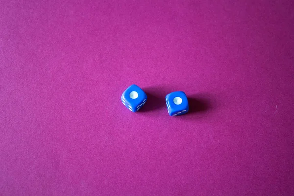 the gaming dice on a red background