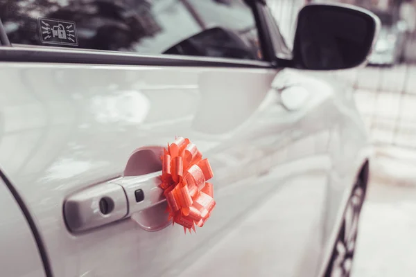 Wedding car decorated with pink bow.Vintage color style.lovae car concept.