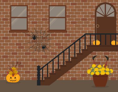 Sundurma, Cadılar Bayramı için dekore edilmiştir. Ön sundurma Halloween süslemeleri. Orada pumpkins, örümcek ağları ve Kasımpatı ve ev tuğla cephe dekoratif cadı ayak arka planda bir pot