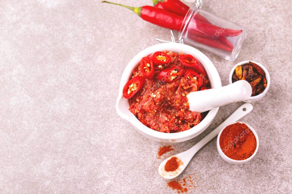 Traditional Maghrebi hot chili pepper sauce paste harissa. Tunisia and Arabic cuisine adjika