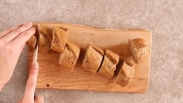Female Hands Slicing Fresh Rye Baguette Wooden Cutting Board Gray — Stock Video