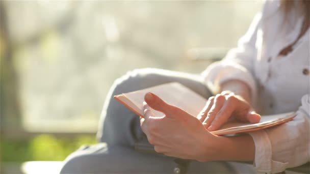 Close Up View Of Elegant Woman Sitting On House Terrace and Reading an Lecture. Young Girl Gets a lot of Leisure From This Book . — стоковое видео