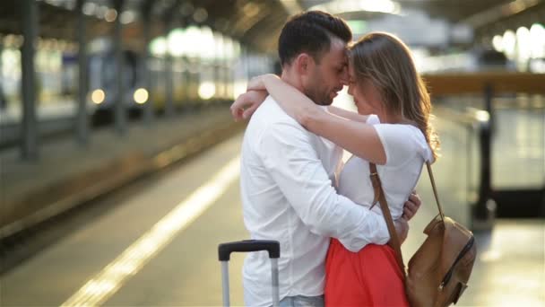 Sad Young Man In Love Caressing And Saying Goodbye To His Girlfriend In Railway Station Before Departing On Sunny Day. — Stock Video